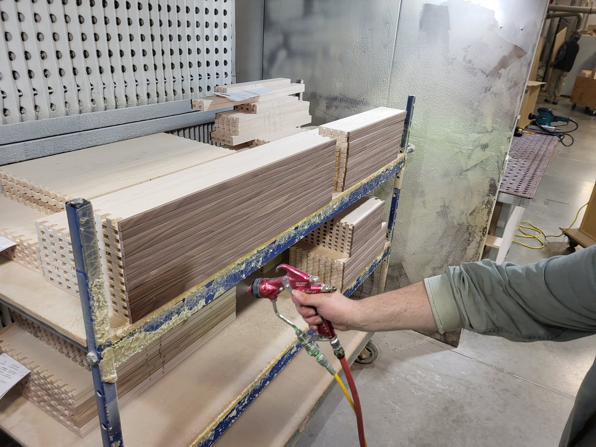 Drawer box being sprayed